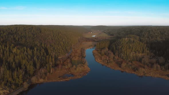 River Connecting with Lake in Nature Reserve Boreal Forest Aerial alt