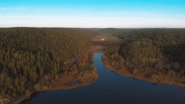 River Connecting with Lake in Nature Reserve Boreal Forest Aerial