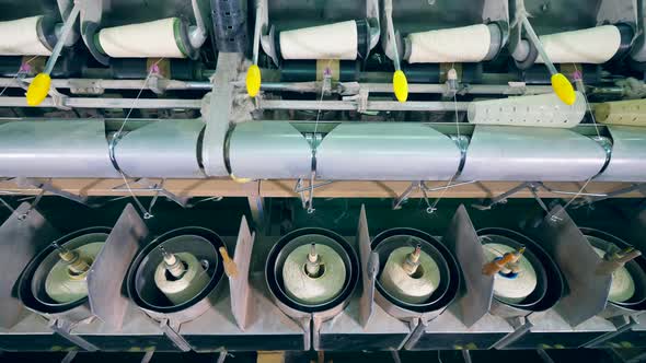 Factory Machines Spool White Threads on Clews Automatically alt