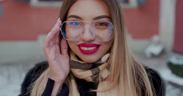 Portrait of Happy Girl Smiling in City alt
