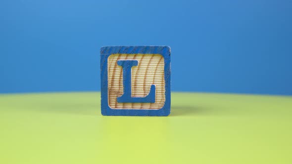 Close up shot letter "L" alphabet wooden block alt