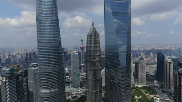 4K SHANGHAI, CHINA Aerial Pudong Towers FLY LEFT  (Around Towers)