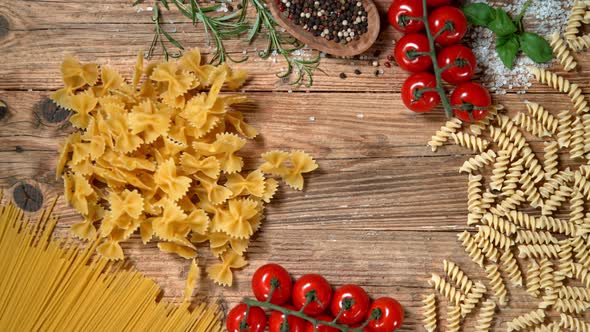 Super Slow Motion Shot of Fresh Farfalle Falling on Italian Decorated Wooden Table at 1000Fps alt