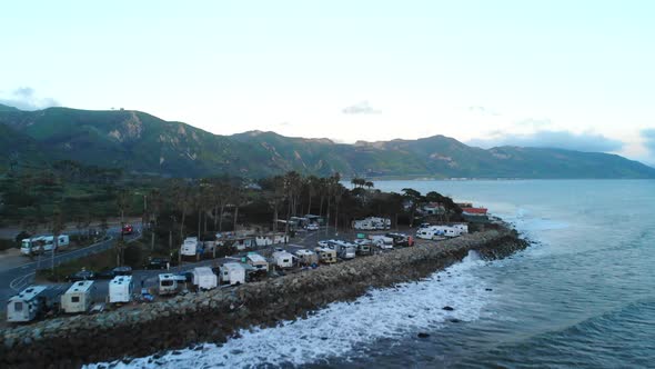 Aerial drone rising over an rv campground on the beach cliffs of Ventura, California with Pacific Oc alt