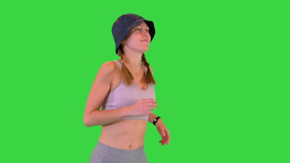 Young Woman in Sport Clothes Running in Panama on a Green Screen Chroma Key