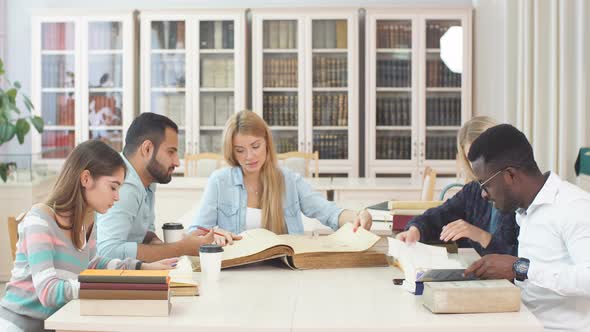 Group of Multiracial People Studying with Books in College