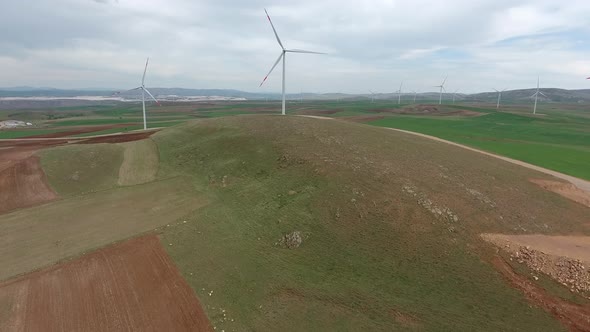 Wind Power Plant on Edge of Brown Treeless Fields in Vast Plain