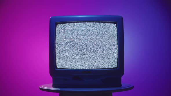 Old Vintage Television on Purple Neon Background Closeup, Stock Footage