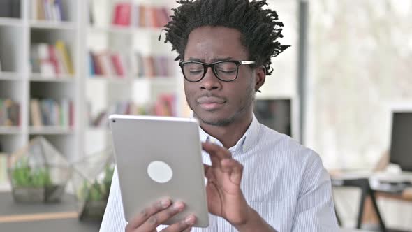 African Man Using Digital Tablet alt