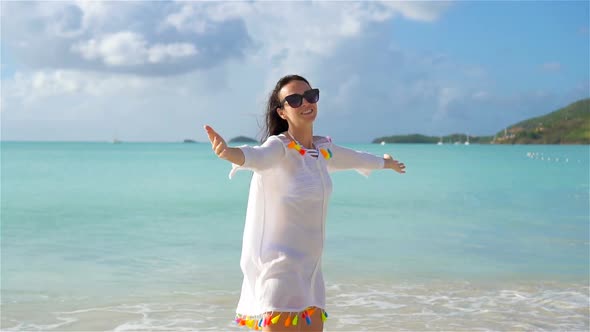 Young Beautiful Woman Having Fun on Tropical Seashore. Happy Girl Walking at White Sand Tropical alt