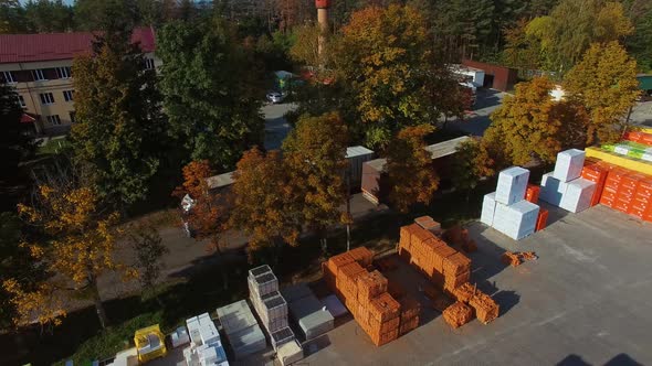 Large distribution warehouse. Aerial view of building materials warehouse alt