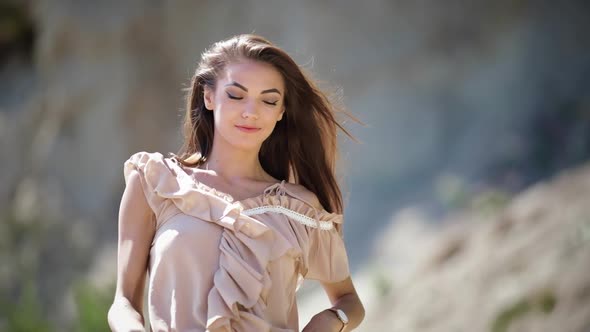 Beautiful smile on an attractive young woman posing during a photoshoot alt