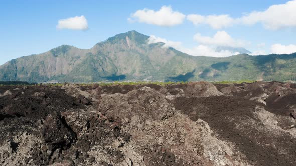 Amazing Panoramic View of Petrified Volcano Black Lava and Mountain Scenery Under Blue Sky with