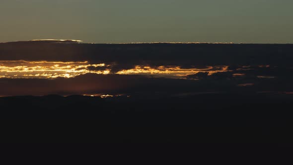 Glorious Sunrise Over Open Prairie with Layers of Clouds Zoom Out