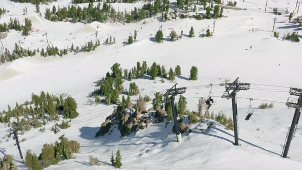 Aerial View Lifts at Mammoth Mountain People Riding Ski Chairs in Ski Resort alt