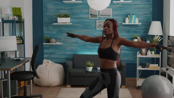 Athletic Woman with Black Skin Warming Up Before Aerobic Class alt