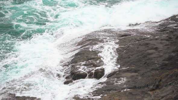 Sea Waves Breaking on The Stony Shore in A Spray alt