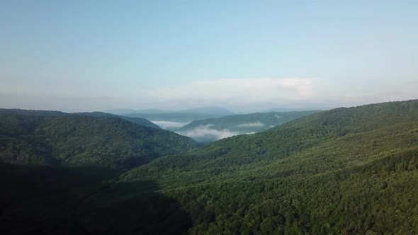 Aerial Landscape View of Caucasus Mountain at Sunny Morning with Fog alt