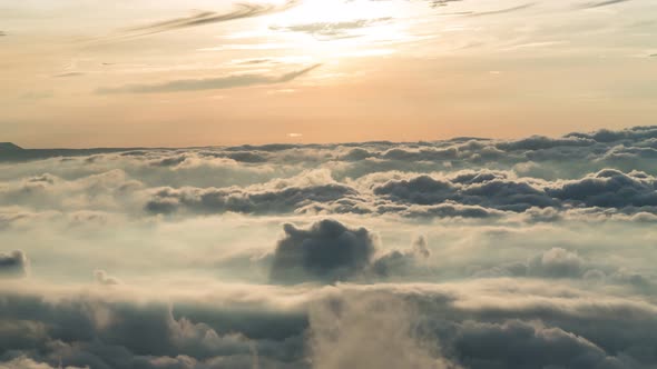 timelapse foggy or over the clouds while sunrise sky.