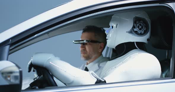 Engineer Testing Car Driving Robot alt
