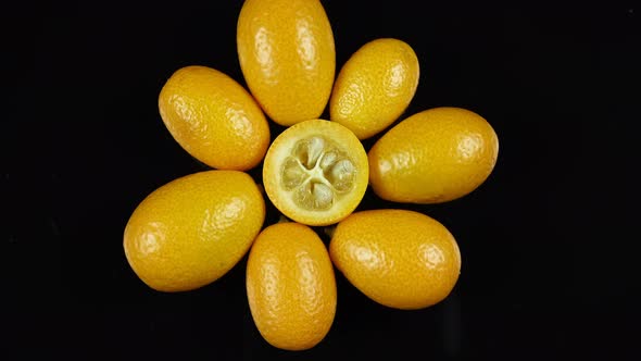 Kumquat Exotic Fruit On Black Background.
