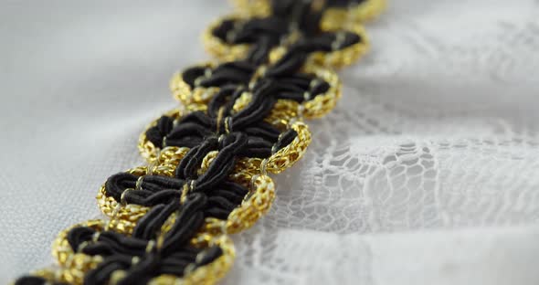 White Lace with Black and Golden Decor Closeup alt