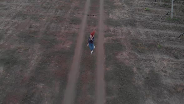 Woman with Red Hair Runs at the Sunset alt