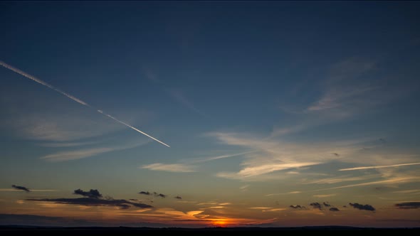 Sunset and Airplane in Sky