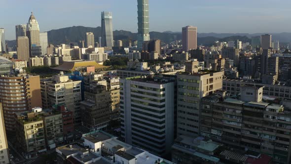Tilt up movement of a drone, moving towards Taipei 101, the famous landmark of Taiwan, world trade c alt