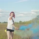 Joyful Woman with Colored Smoke Bombs Outdoors - VideoHive Item for Sale