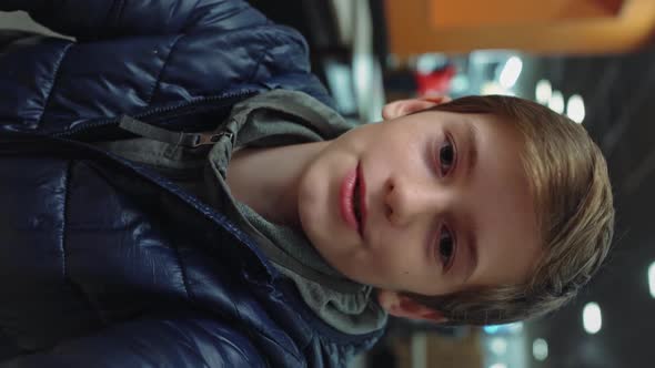 Vertical Video Handsome Young Boy Talks During Conference Video Call in Cafe alt