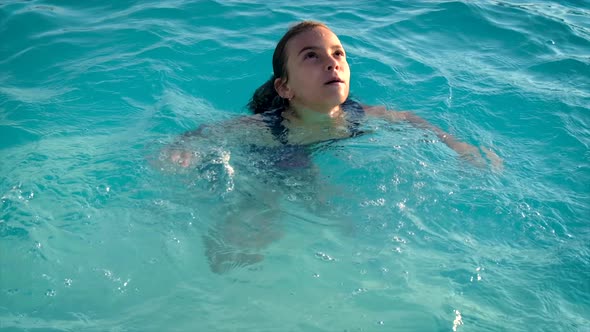 The Child is Drowning in Water