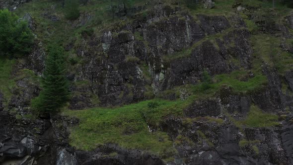 Aerial View On Rocky Slope In The Mountain alt