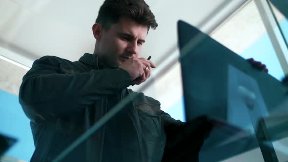 Cute hacker breaks into a system with a laptop alt