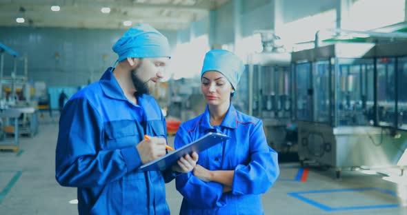 Workers at the Factory are Engaged in Their Own Business and Report on the Production of Household alt