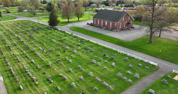 Mennonite church meetinghouse in Lancaster County Pennsylvania. Cemetery graveyard burial site. Aeri alt