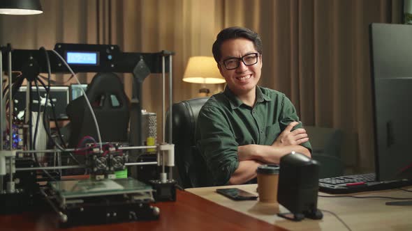 Asian Man Pose While Works On Personal Computer And 3D Printer In Home Office alt