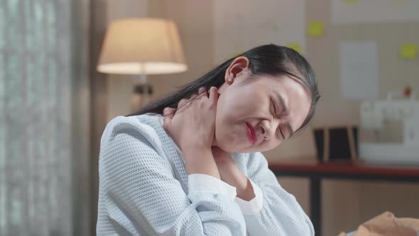 Close Up Of Asian Woman Designer Is Tried While Drawing On The Layout Bond At The Office alt