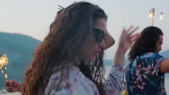 Beautiful Lady Dancing at Lake Party with Friends alt