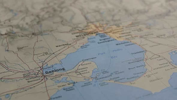 Slider Shot With Shallow Depth of Field to Reveal the Australian City of Melbourne on a Printed Map alt