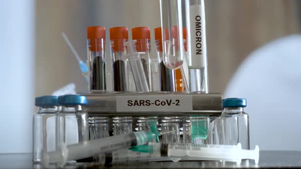 Laboratory SARS COV 2 Test Tubes Labelled Alpha Gamma Delta Beta And Omicron Variants Being Placed I alt