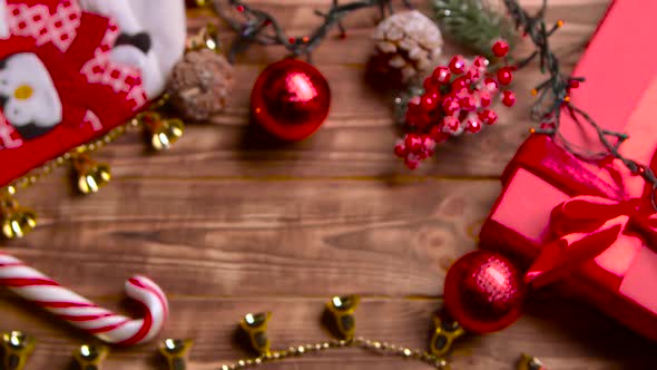 Different New Year's Toys Sweets and Flowers Lie on the Table. Top View alt