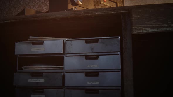 Retro room with vintage radio station standing on the desk under obsolete lamp. alt