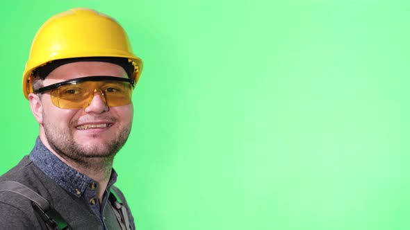 Young Engineer in Protective Helmet on a Background of Chromakey alt