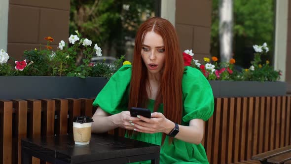 Portrait of Happy Amazed Young Woman Getting Online Message on Mobile Phone with Amazing News alt