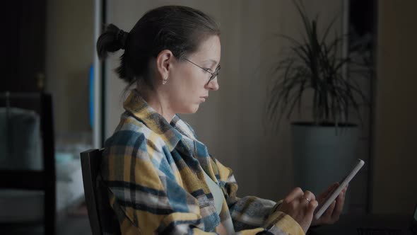 Woman Using Cell Phone At Home alt