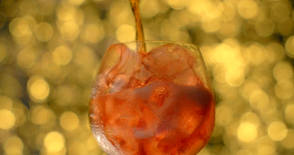 Cocktail is Poured to the Glass Full of Ice Ice Cubes and Sprinkling Soda  120Fps Prores HQ alt