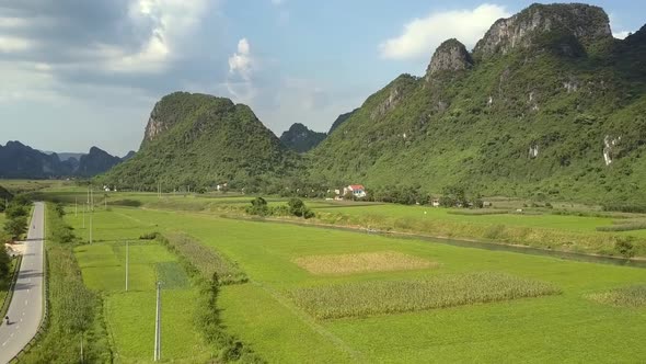 Aerial Motion Above Fields Between Highway and Narrow River alt