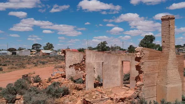 Flying towars Silverton in outback New South Wales passing over abandoned buildings alt