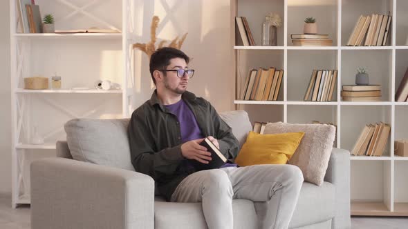 Finished Book Home Reading Man Unhappy Story Sofa alt